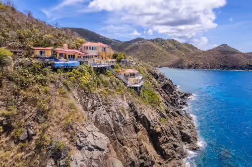 Exterior at Private cliffside retreat full of magic. 9 bedrooms, 21 beds