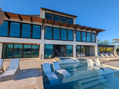 Beachfront estate home with private 70’ dock and 7500sq ft. of living space