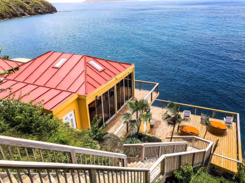 The Vision is built into the cliffs, right at the edge of the ocean. at Private cliffside retreat full of magic. 9 bedrooms,