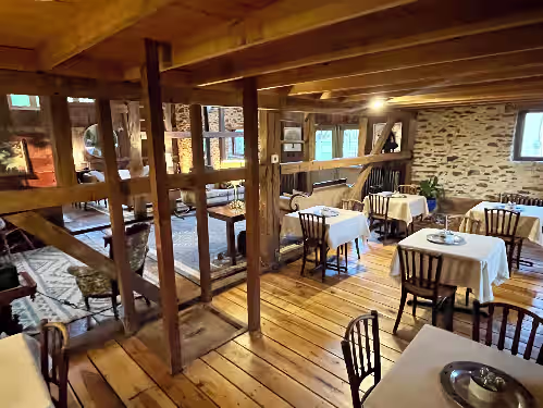 Dining area with stone walls at Beautiful Converted Barn with 9 Beds and Baths on 10 Acre Farm in Bucks County