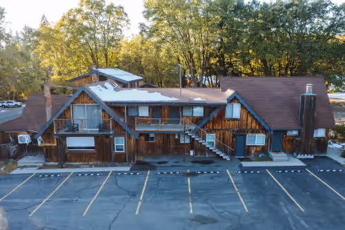 Front doors for suites 4-8 and parking lot for suites 3-8 at Basecamp Lodge