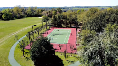 Full tennis court and small basketball court at PermaVista Ranch & Resort- Experience A Luxury Texas Ranch