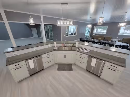 20' Kitchen Island w/ Handsfree Faucet and Dual Dishwashers at Woman Lake Beach House